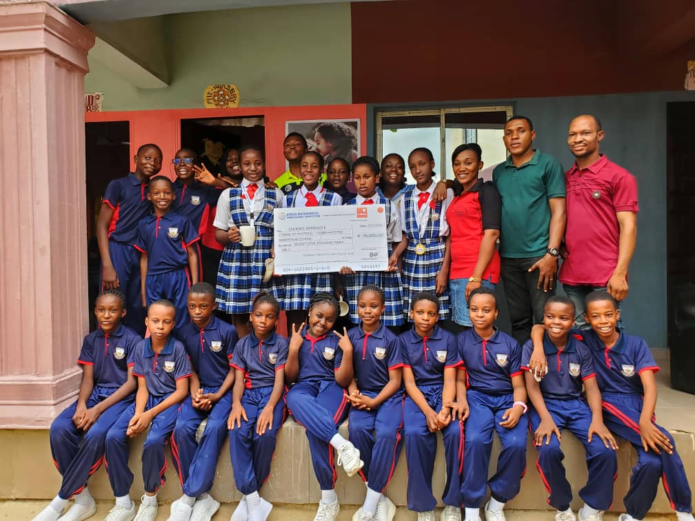 High school students showcasing their award